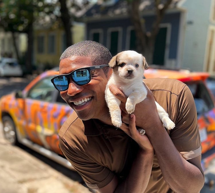 ups driver jason hardesty posing with dogs