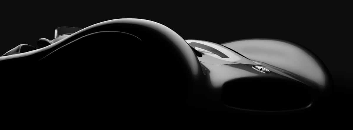 Black and white image showing the curves of a car