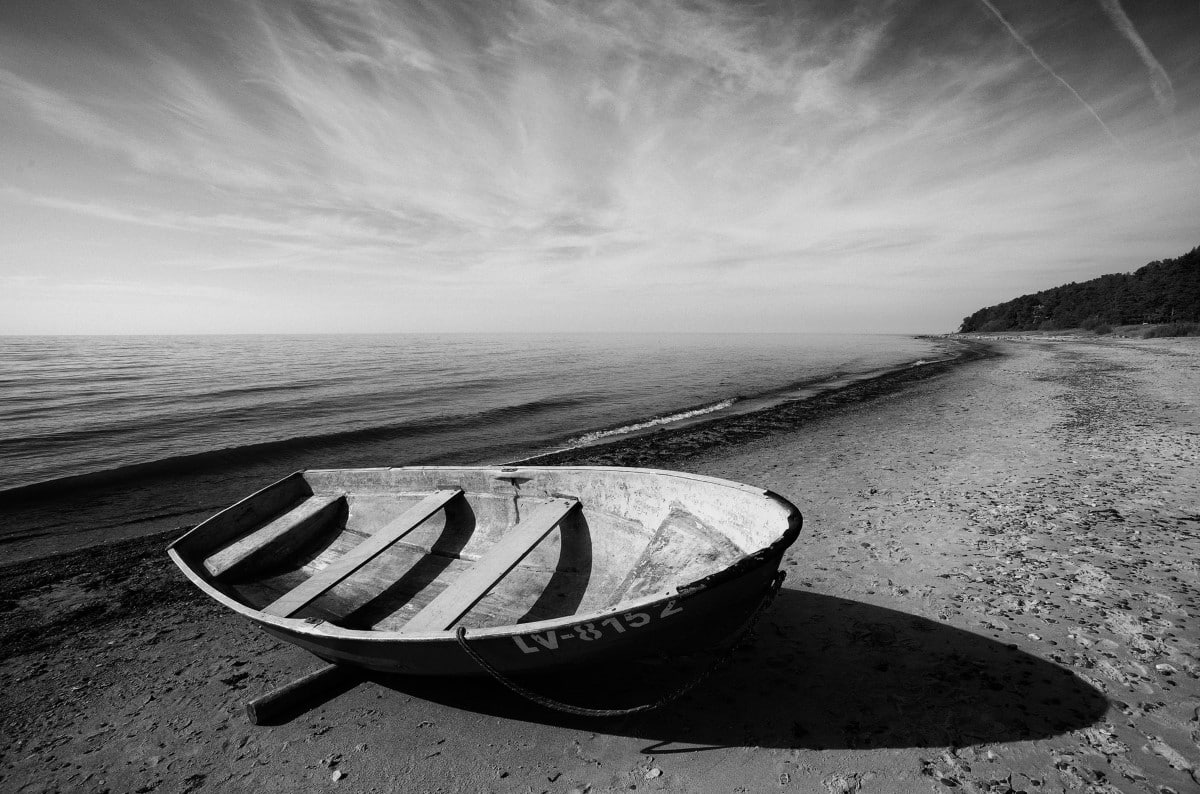 Wood boat on the beach in Tuja