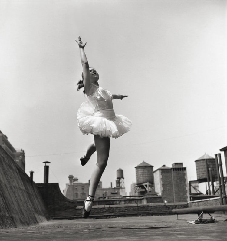 Ballerina leaping on the roof in NYC by Elliott Erwitt