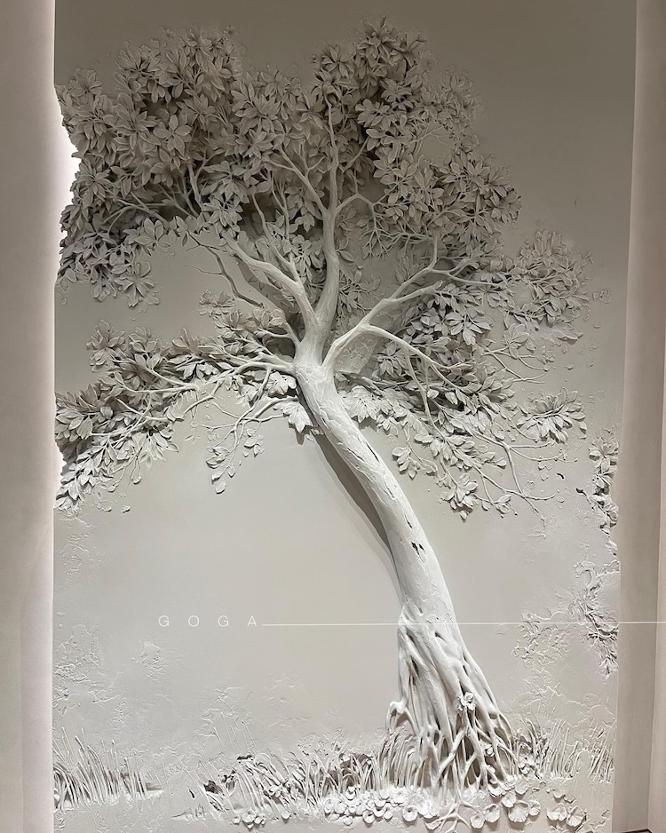 Bas-relief sculpture of a tree on a wall by Goga Tandashvili