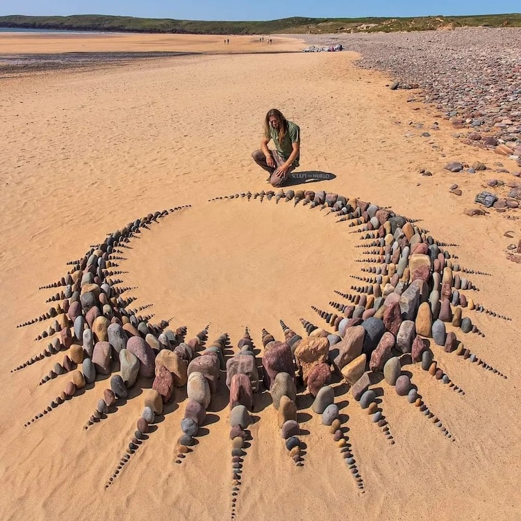 Crown-shaped stone art on a beach by Jon Foreman