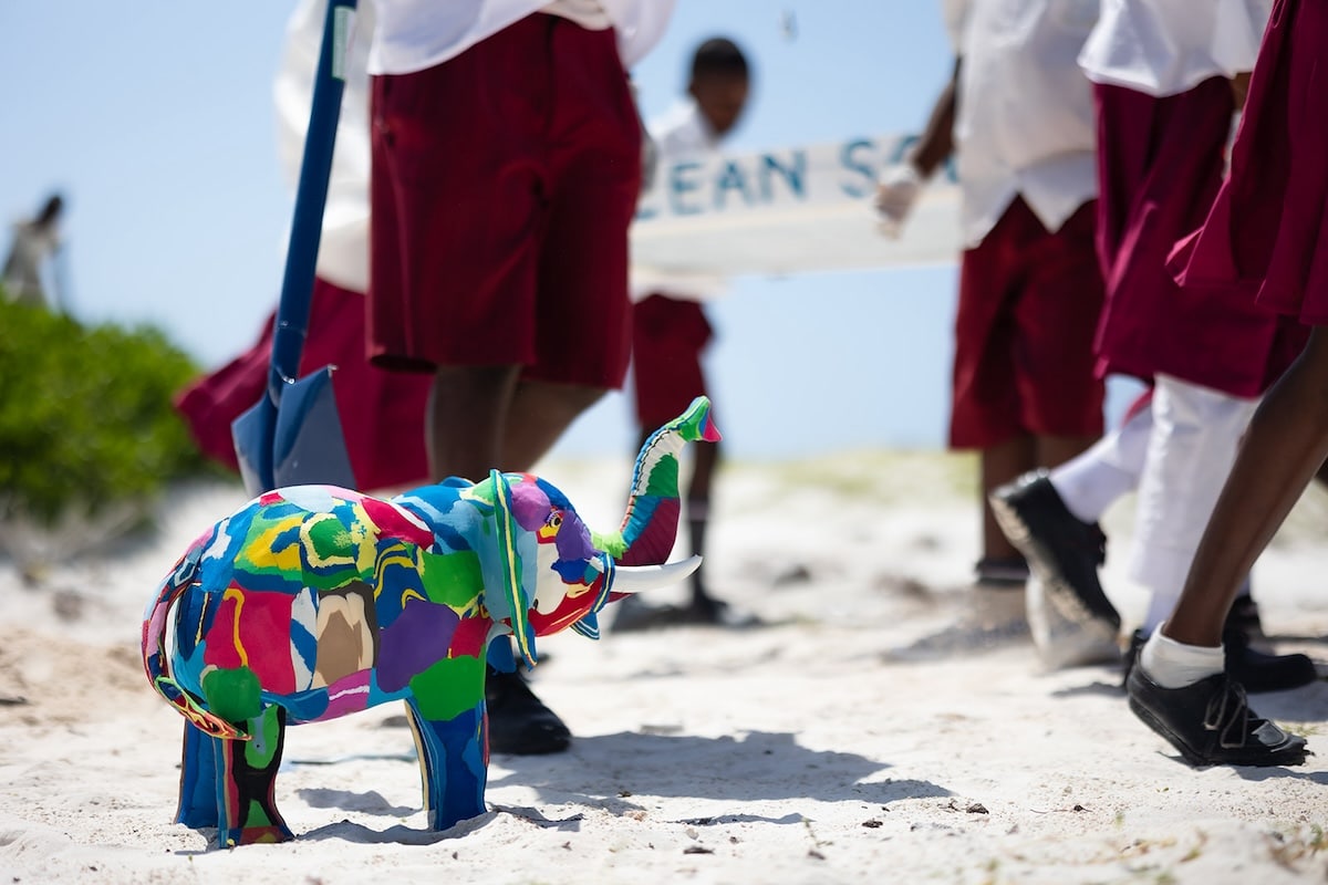 Tiny elephant sculpture made of colorful flip-flops