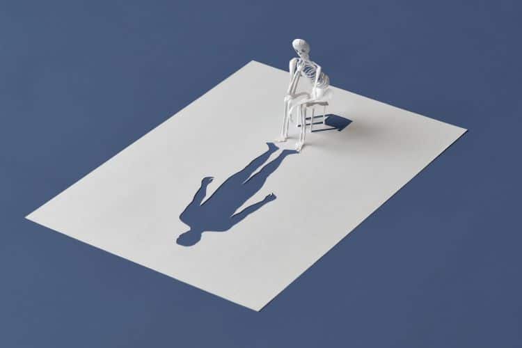 Peter Callesen Paper Sculpture Of Skeleton Staring At Cutout Of Person