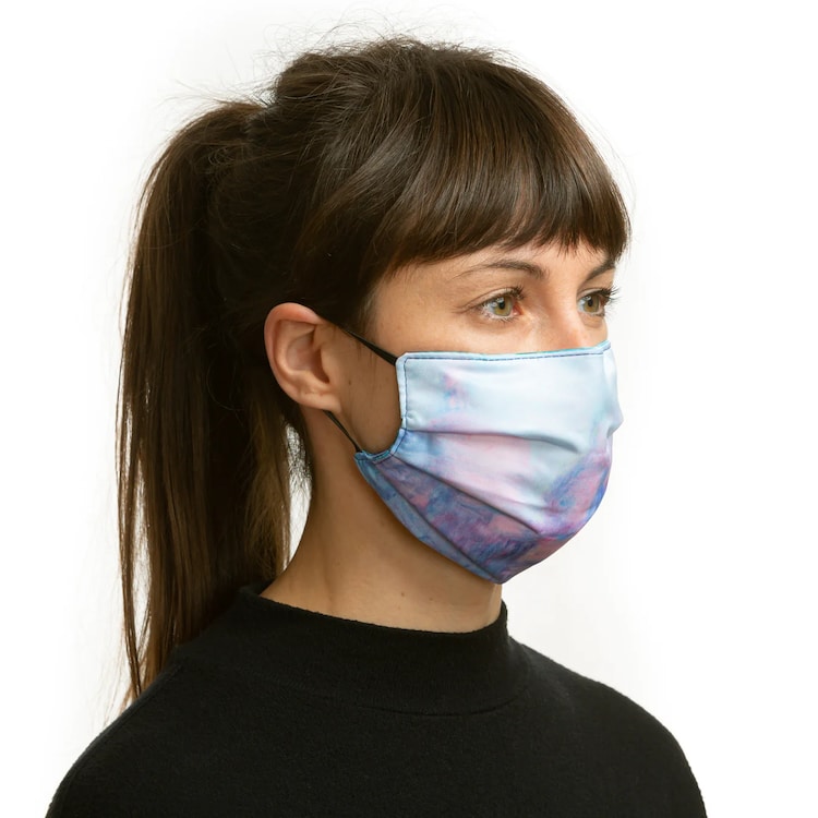 Woman wearing a Monet Waterlillies face mask reverse side