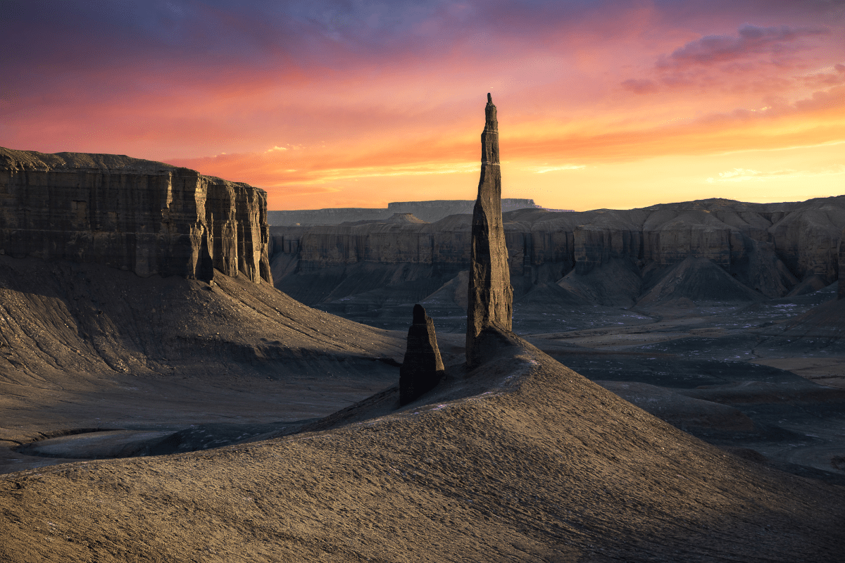 A strange spire juts out of the barren landscape of the Utah Badlands