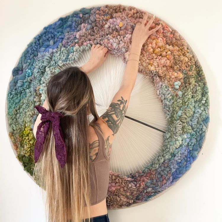 Alison Altafi Works On Her Multicolored Cylindrical Tapestry