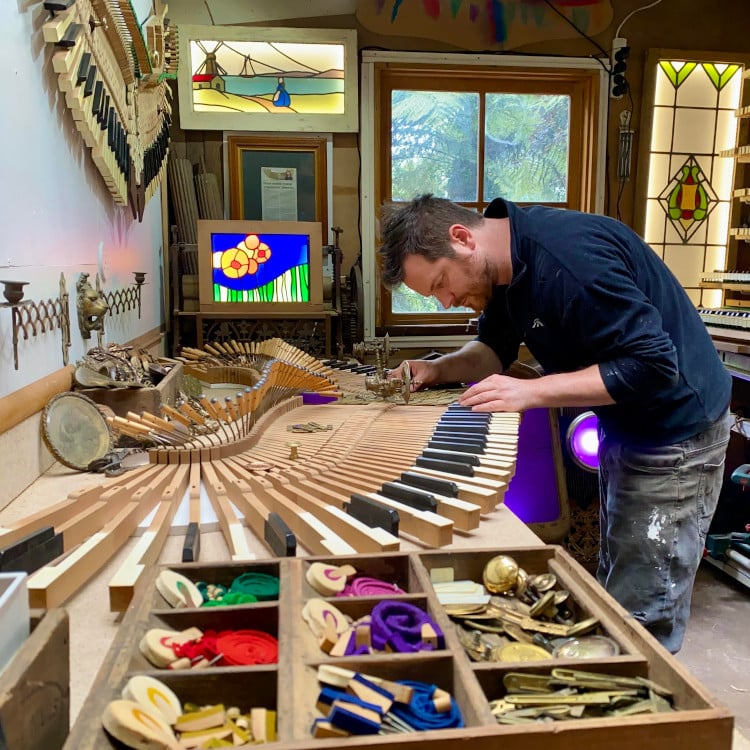 David Cox building his phoenix sculptures made out of old pianos