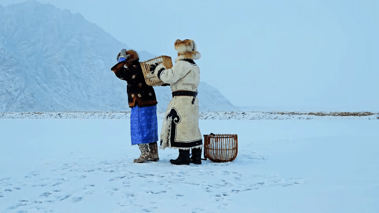 Mongolians Dressed In Traditional Clothing With Wooden Baskets On Their Back