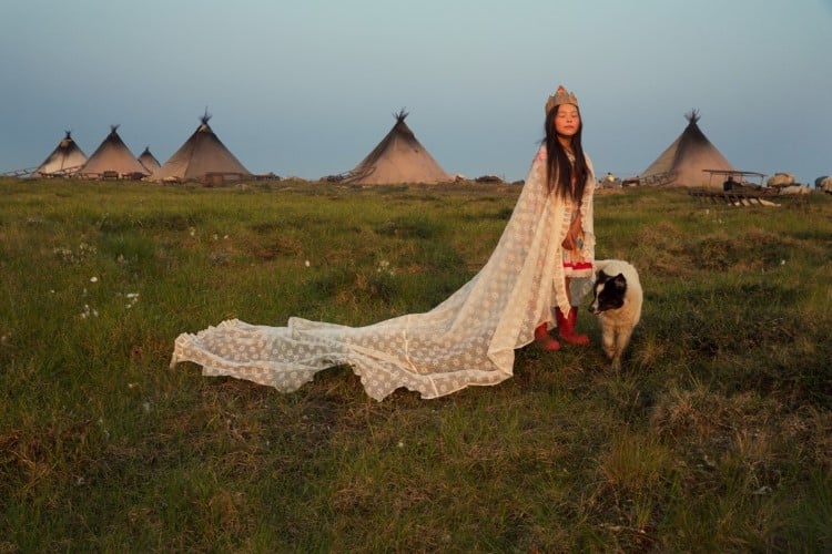 Young girl playing dress up at Nenets camp
