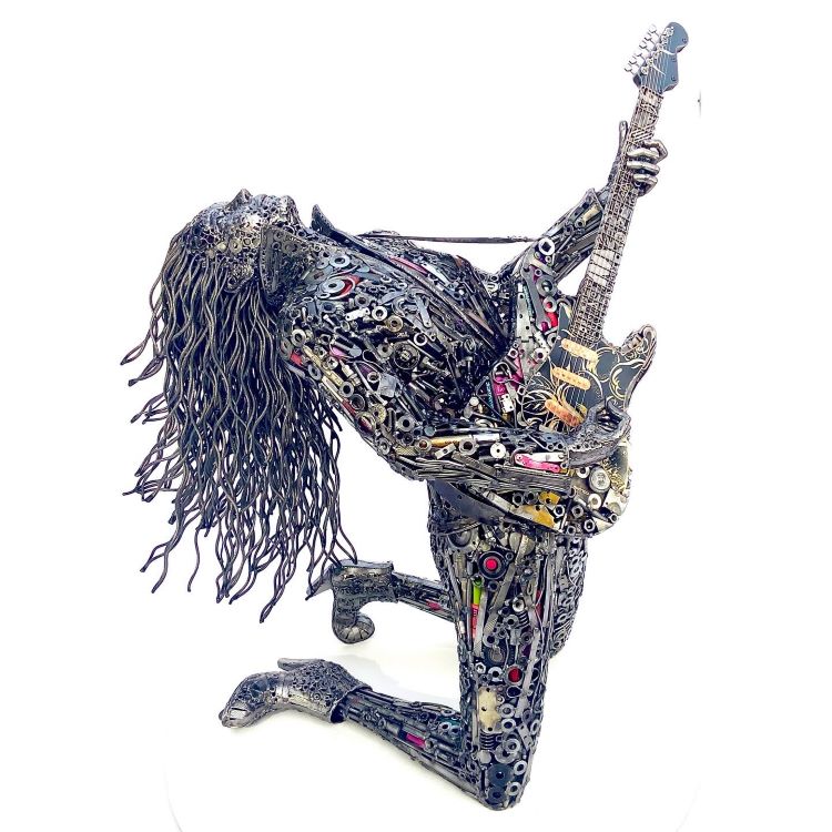 Sculpture Of Rockstar With Guitar Made Out Of Scrap Metal