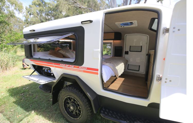 Photo From The Outside Of A Camper Showing The Inside Cabin