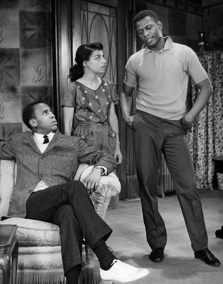 Photo of a scene from the play A Raisin in the Sun. From left-Louis Gossett (George Murchison), Ruby Dee (Ruth Younger) and Sidney Poitier (Walter Younger). Everyone shown in the photo reprised their roles in the 1961 film.