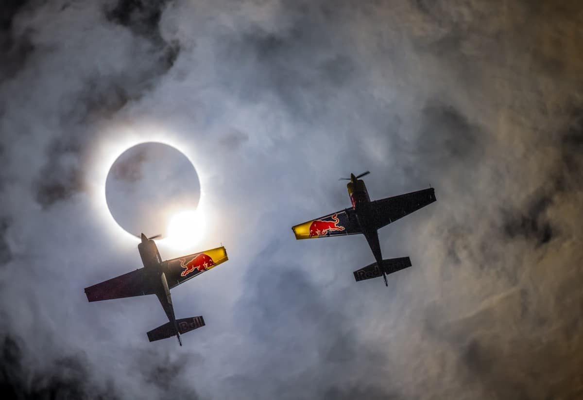 Red Bull Aerobatic Pilots Fly Through Rare Solar Eclipse