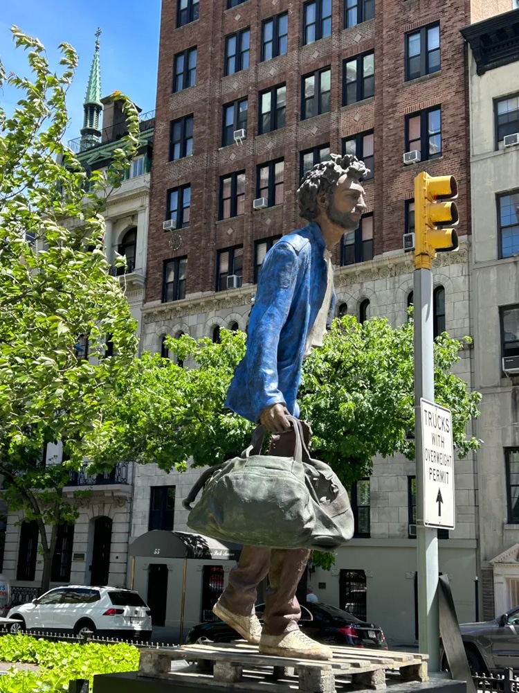 Bronze sculpture by Bruno Catalano, part of his Travelers series on display in New York City