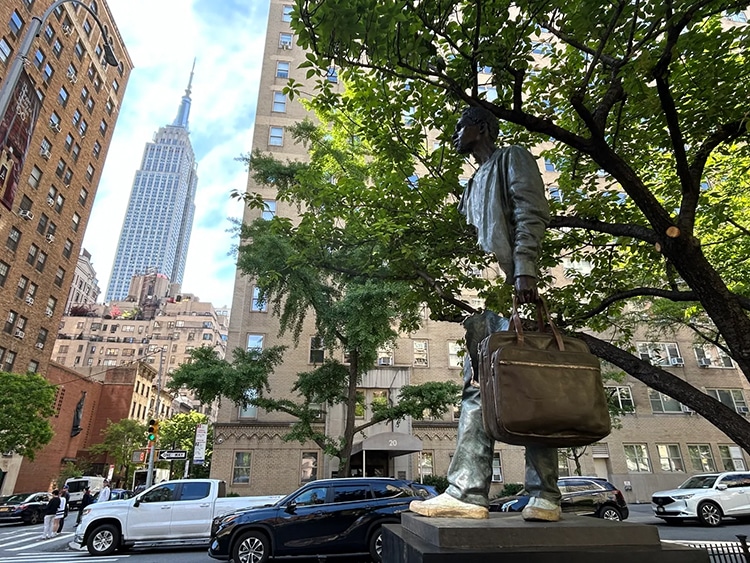 Bronze sculpture by Bruno Catalano, part of his Travelers series on display in New York City