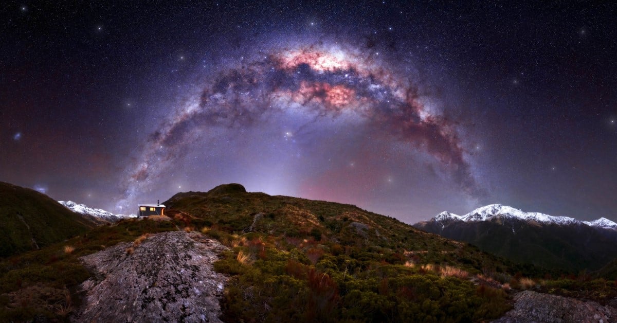 Milky Way over bluff hut in Mungo River Valley, West Coast, New Zealand
