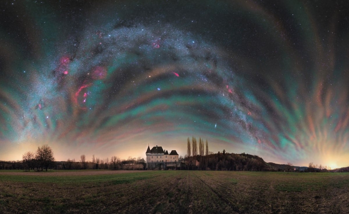 Milky Way with chemiluminescence over medieval castle in France