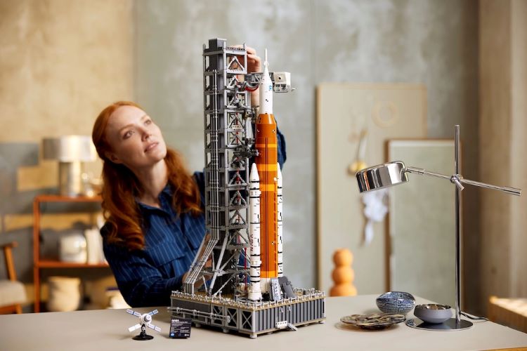 Picture Of Completed Artemis Rocket LEGO Set With Woman In Background