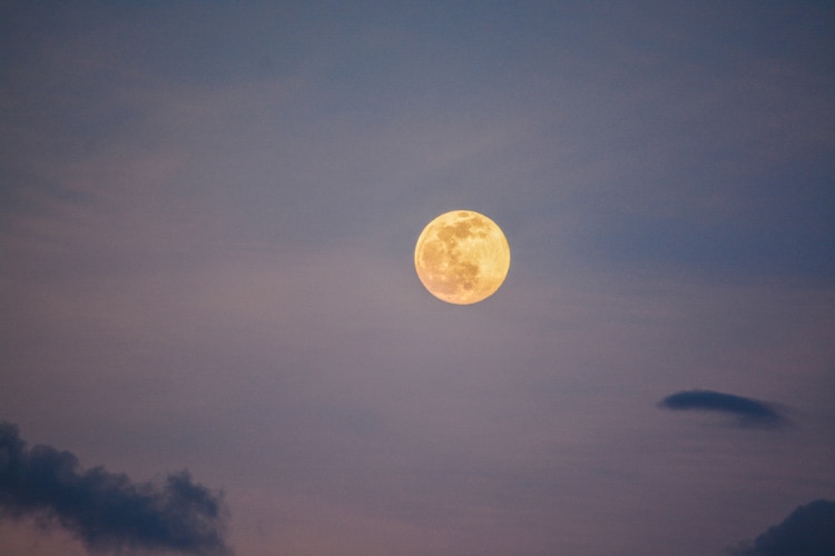 Full moon in the early evening sky
