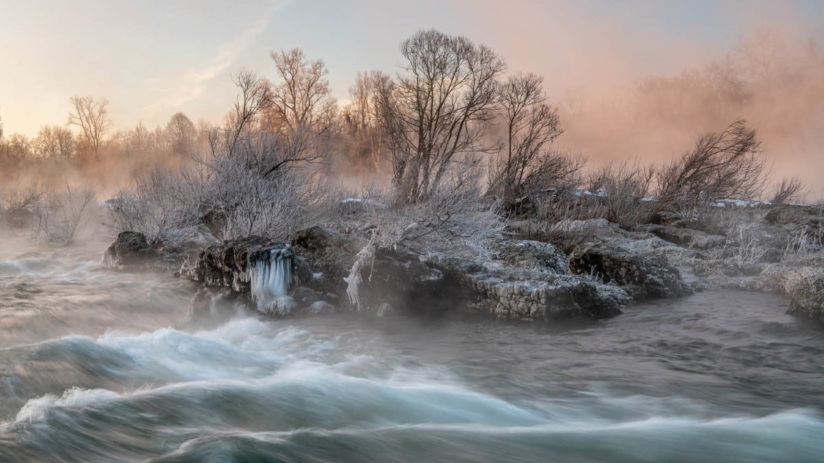  The Rhine flows over a limestone formation at Istein Cataracts. Severe frost and soft morning light create a mystical scene.