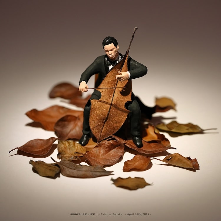 Miniature Calendar art project by Tatsuya Tanaka of mini figure cellist playing a cello that is actually a leaf