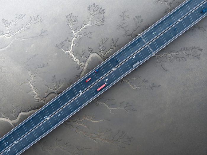 Aerial photo of highway over dried river bed