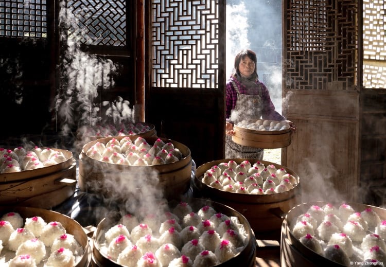 Woman with red bean dumplings in China