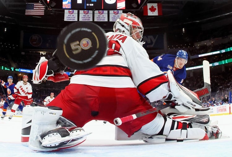 Hockey goal with puck in the frame