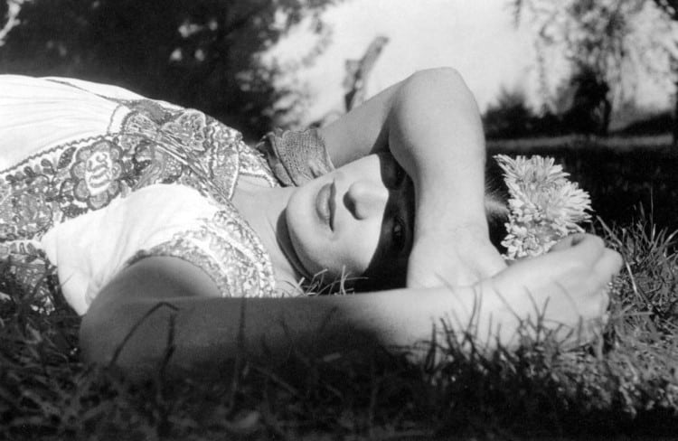 Rosa Covarrubias portrait of Frida Kahlo lying on the grass