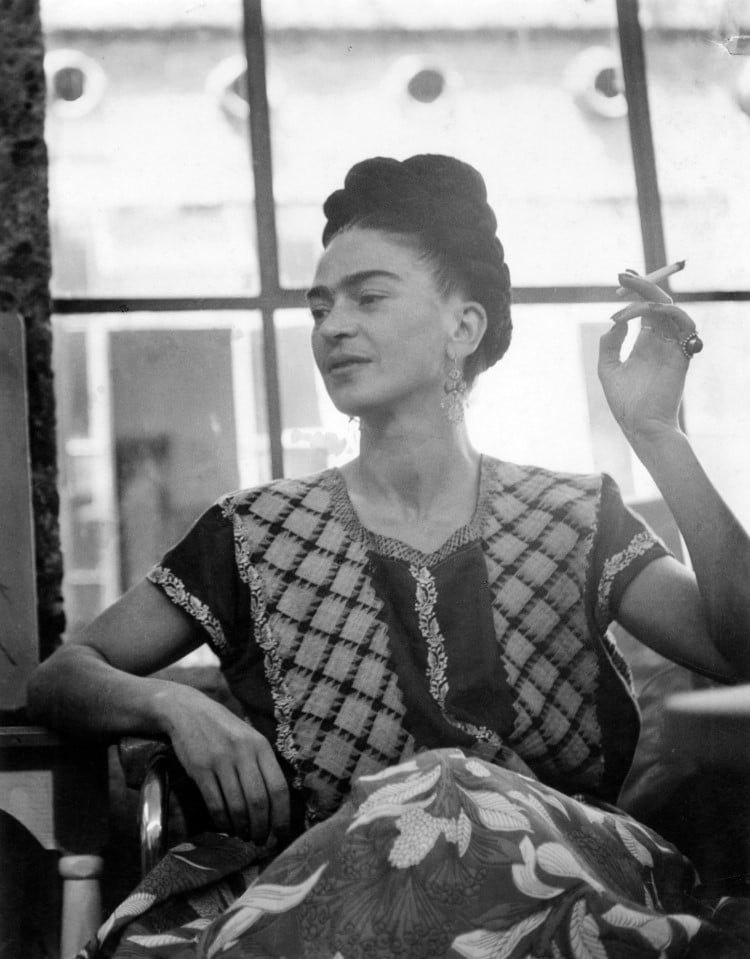 Portrait of Frida Kahlo smoking a cigarette by Lola Álvarez Bravo