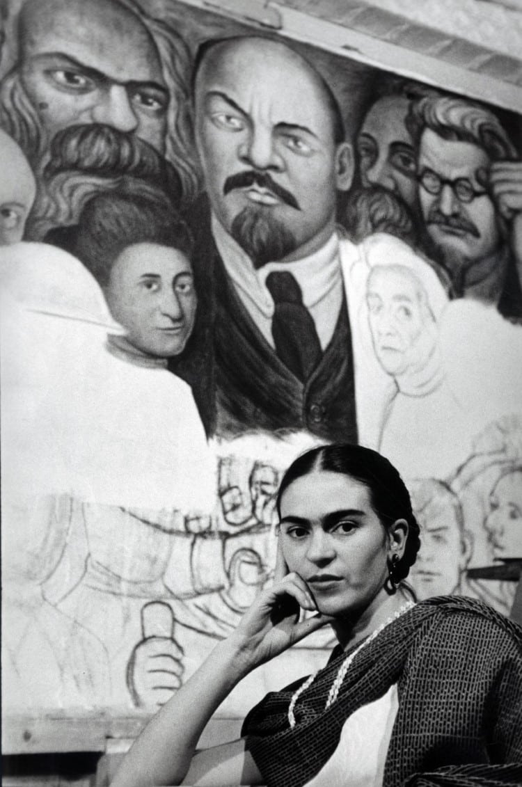 Frida Kahlo in Front of Proletarian Unity from the mural, "Portrait of America" for theNew Workers School