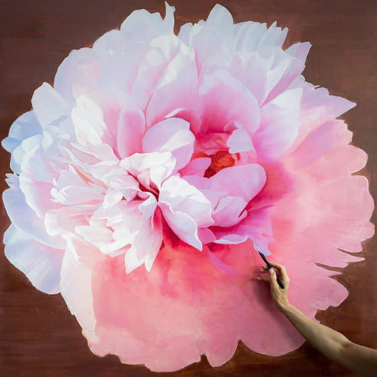 Detailed Painting Of A Pink Peony With Painter's Hand In Frame