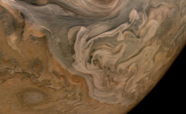 The three-dimensional character of Jupiter's cloud decks is captured in this image of the planet's North Equatorial Belt.