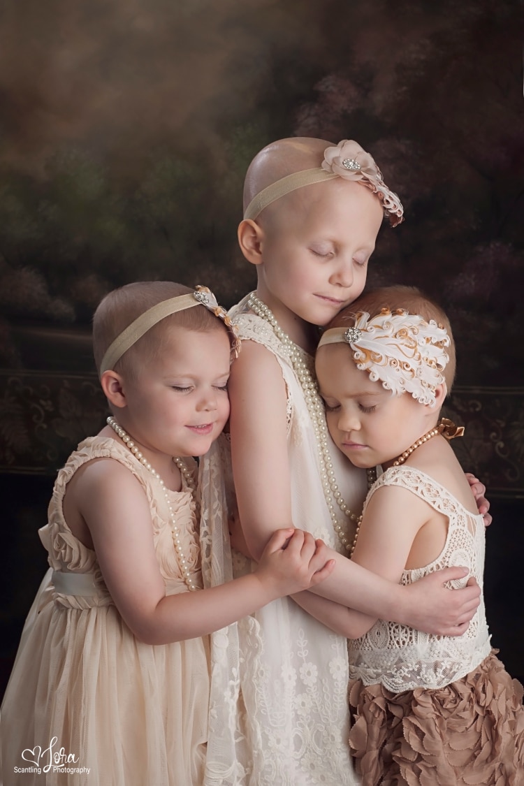 Original photo of young cancer survivors Rheann, Rylie and Ainsley 10 ago
