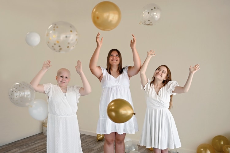 Young cancer survivors Rheann, Rylie and Ainsley celebrating 10 years in remission