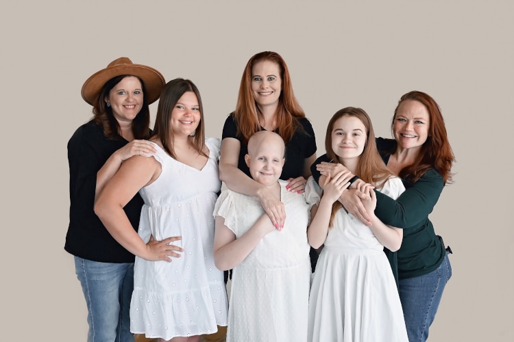 Young cancer survivors Rheann, Rylie and Ainsley with their moms