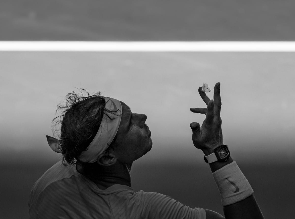 Rafael Nadal with a moth on his finger