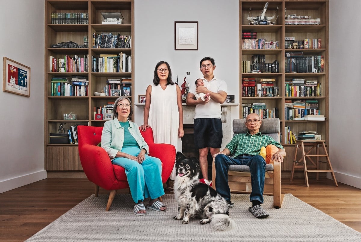 Portrait of a family sitting in their living room