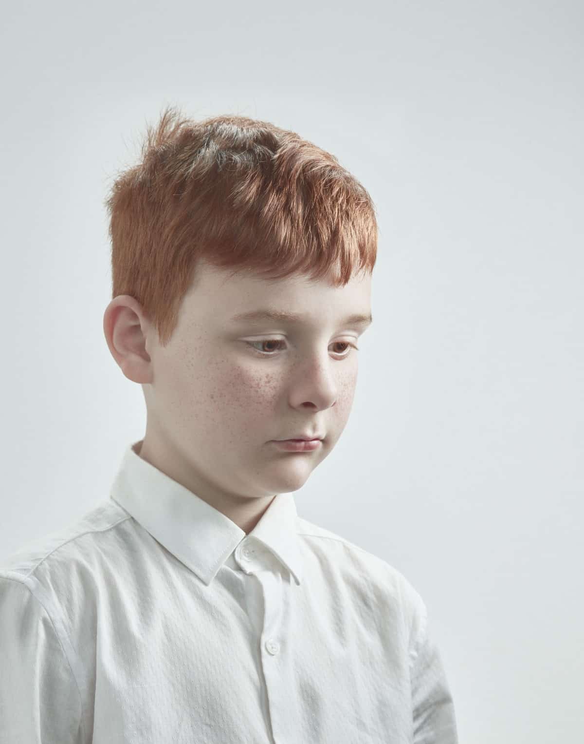 Portrait of a young red headed boy