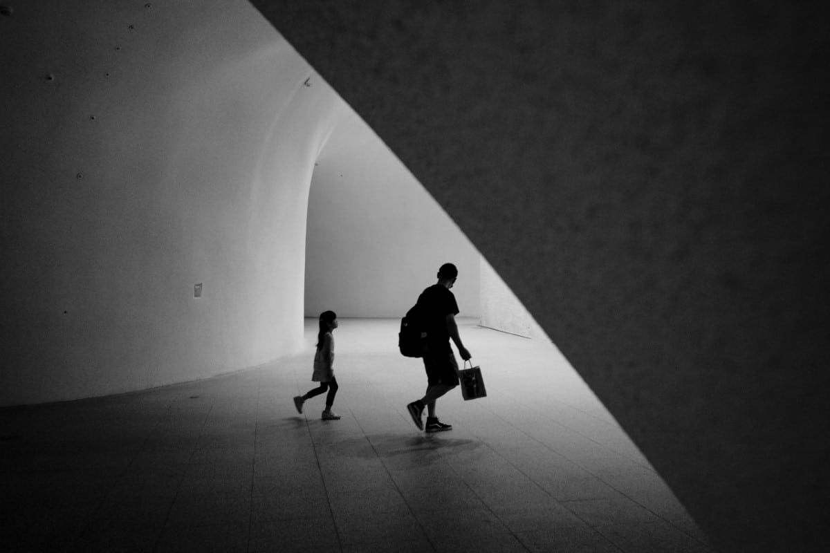 A little girl follows in her father's footsteps to explore the unique architecture of the National Taichung Theater in Taiwan.