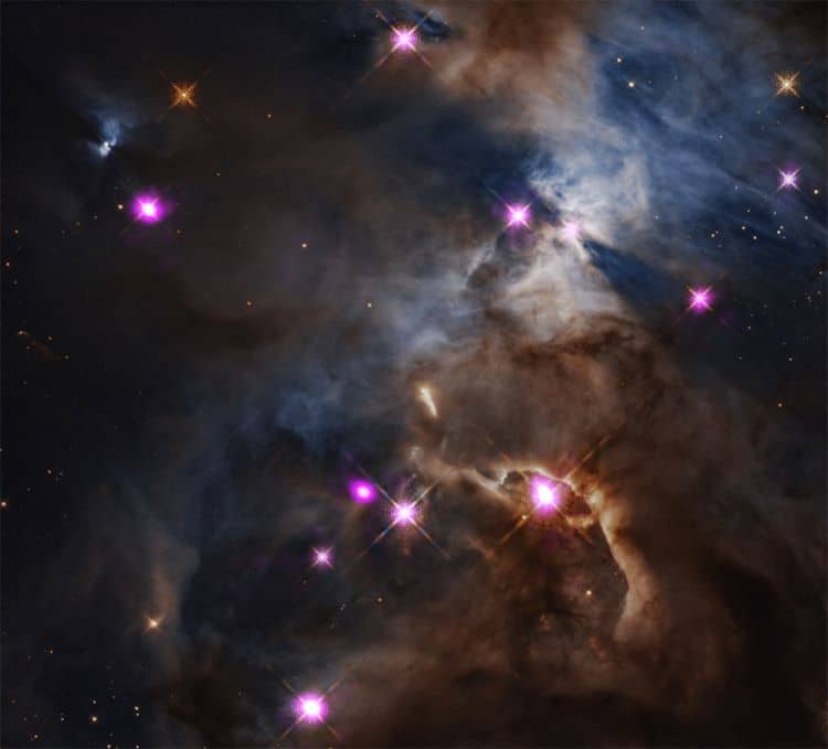 Photograph Of Blue And Brown Milky Space Clouds With Purple Stars In Space