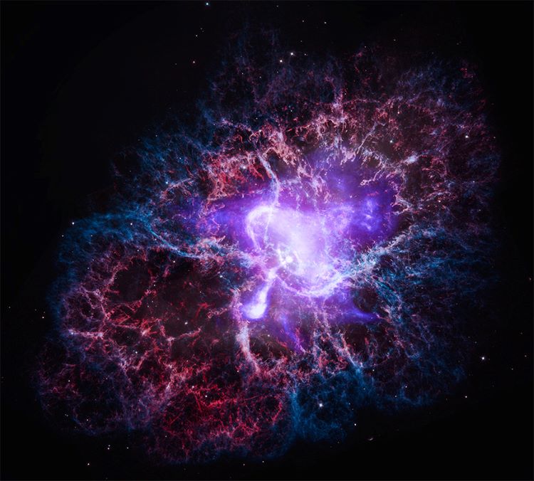 Purple And Red Composite Photo Of The Crab Nebula In Space