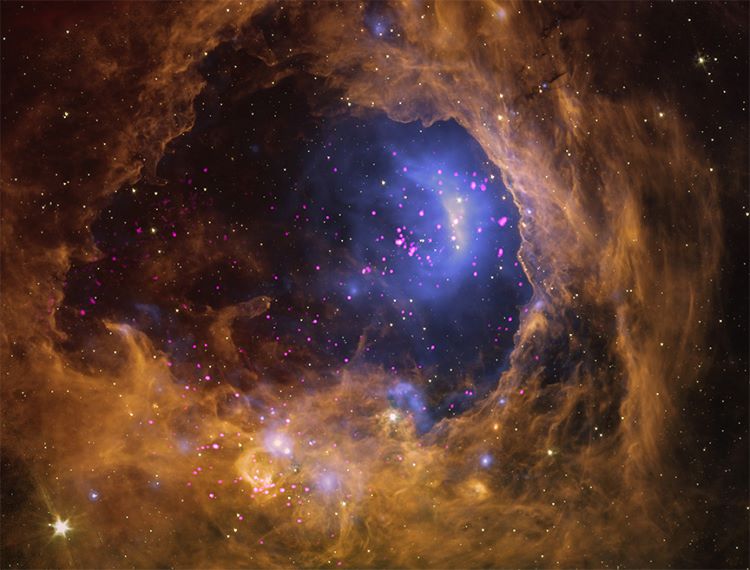 Nebula With Yellow Swirling Clouds And Blue Stars
