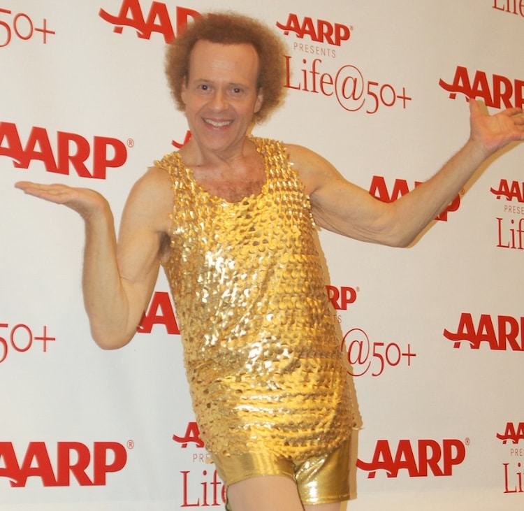 Richard Simmons wearing a shiny gold outfit