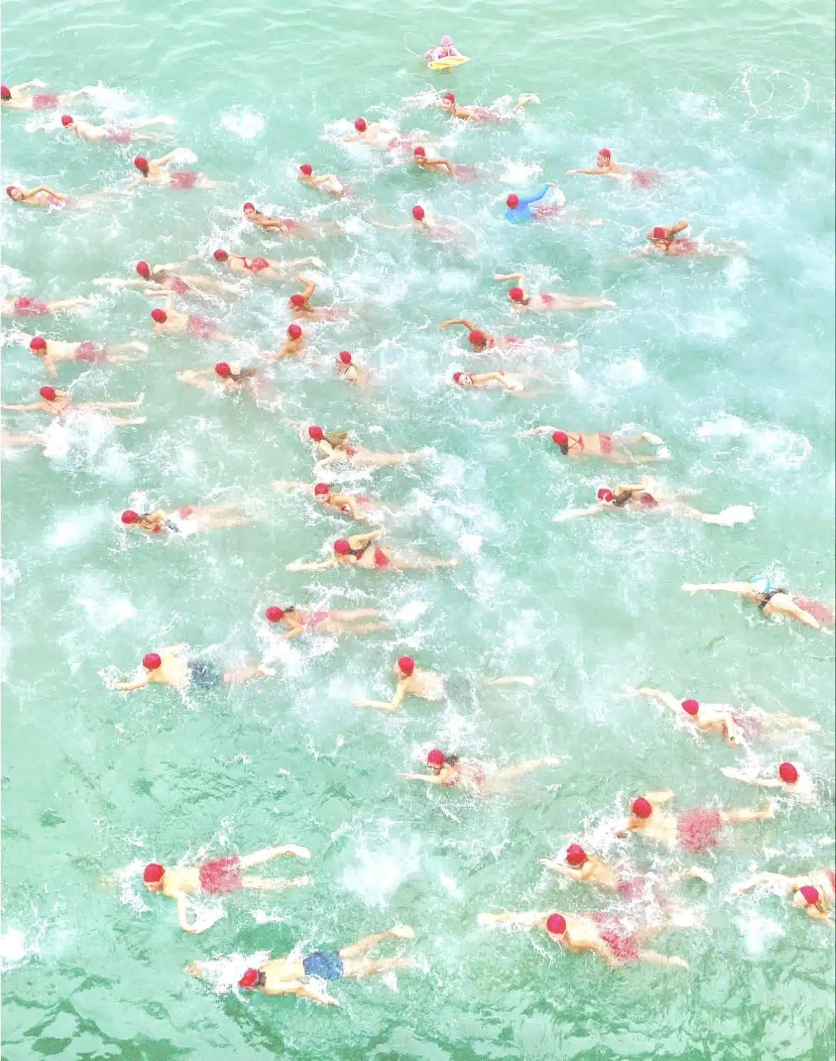 Aerial photo of lifeguards swimming at Huntington Beach