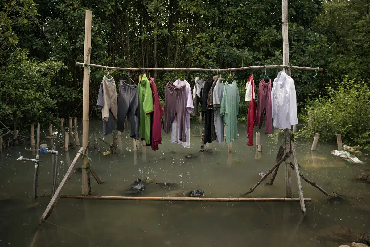 Clothes line above waterline in Demak Regency