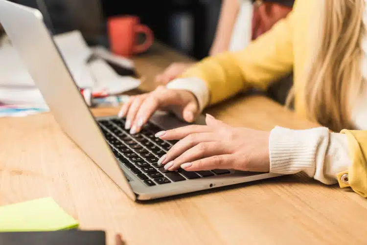 Woman typing on computer