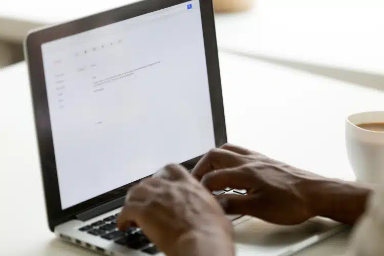 Man typing on computer