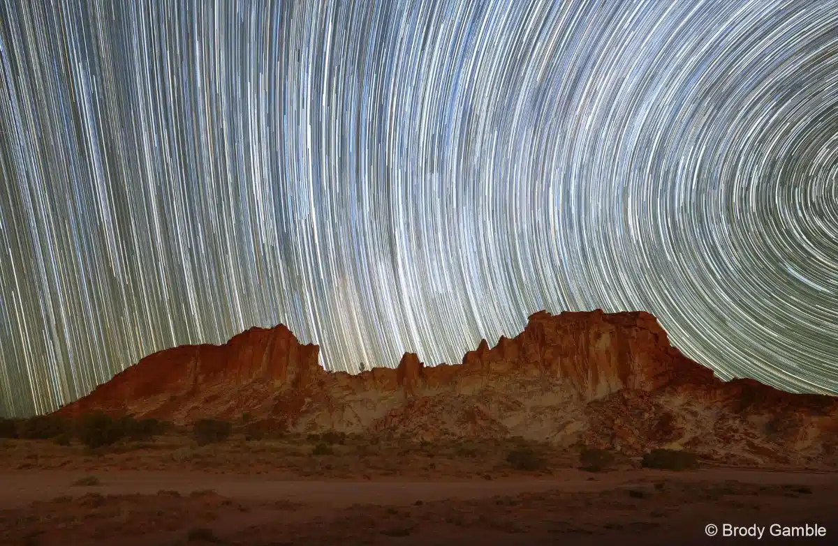 Star trails over the sandstone bluffs of Rainbow Valley